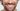 Close-Up Portrait of Smart Looking Man with Bright Toothy Smile